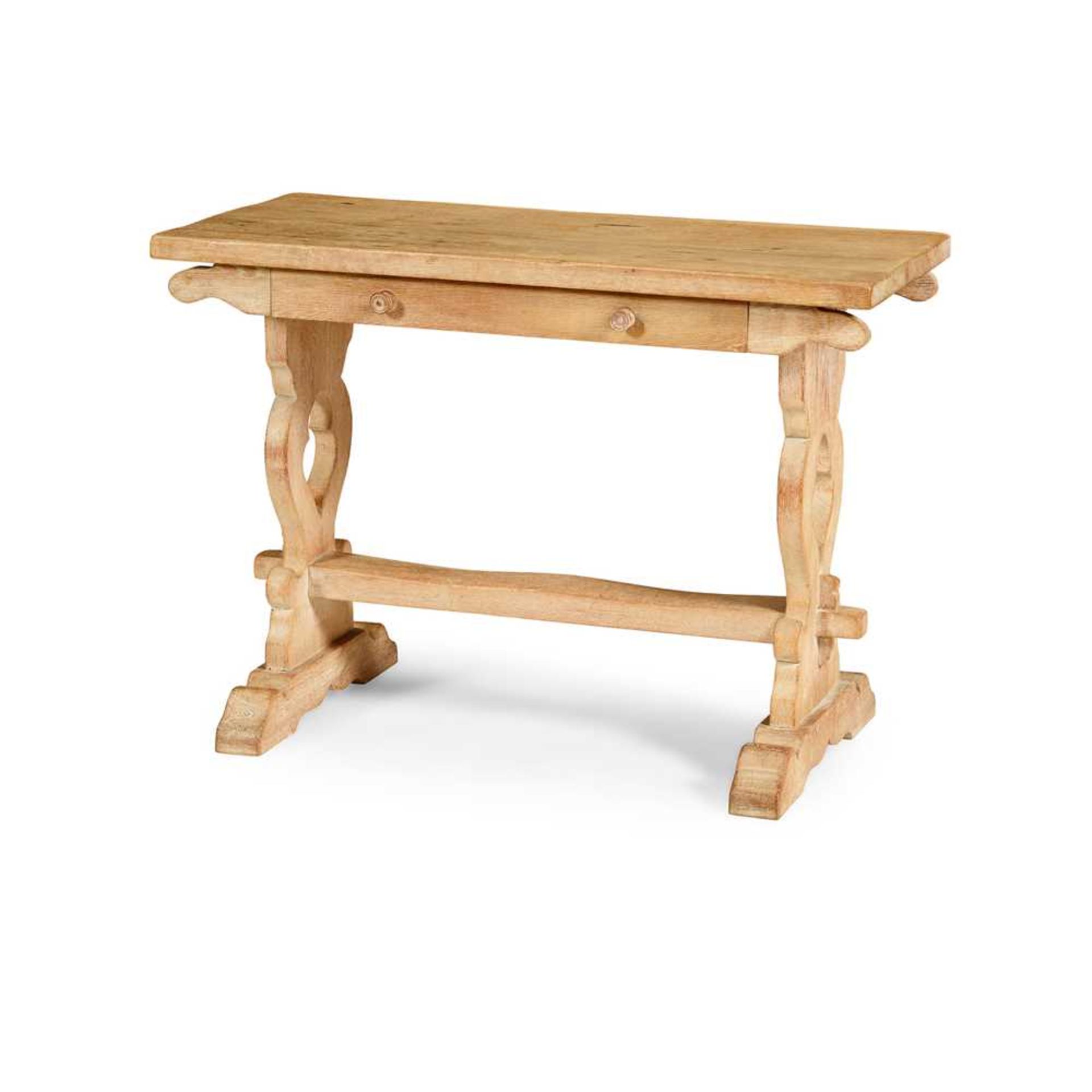 A LIMED OAK TRESTLE TABLE IN THE MANNER OF SIR ROBERT LORIMER EARLY 20TH CENTURY