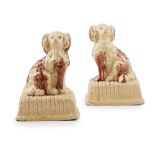 A PAIR OF SCOTTISH GLAZED POTTERY SPANIELS LATE 18TH CENTURY