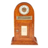 EDWARDIAN OAK AND BRASS LETTER BOX AND CLOCK EARLY 20TH CENTURY