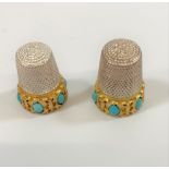 Two turquoise mounted white metal thimbles