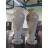 A Pair of Algerian Onyx Vases. 20th Century. Of slender baluster form. 33cm high