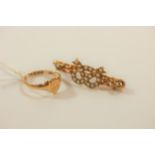 An 18 carat gold ring and a bar brooch set with seed pearls