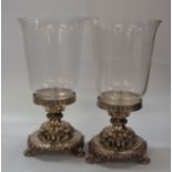 An Impressive Pair of Storm Lamps with Silver Plated mounts. 20th century. Each cast with Lions
