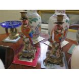 After Meissen originals. A pair of ceramic parrot candlesticks. 20th Century. Gilt metal mounts.