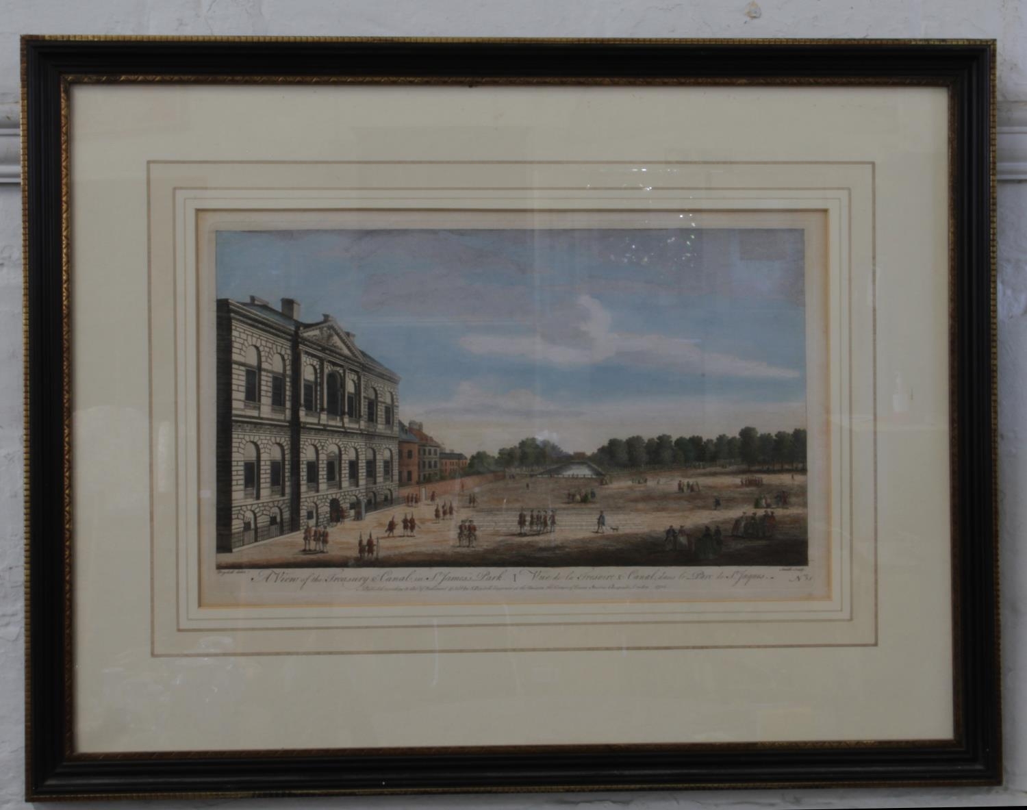 A coloured engraving. A view of the Treasury and canal in St James's Park. Framed. 24cm x 40 cm