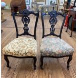 A pair of Salon chairs with carved backs, on castors (2)