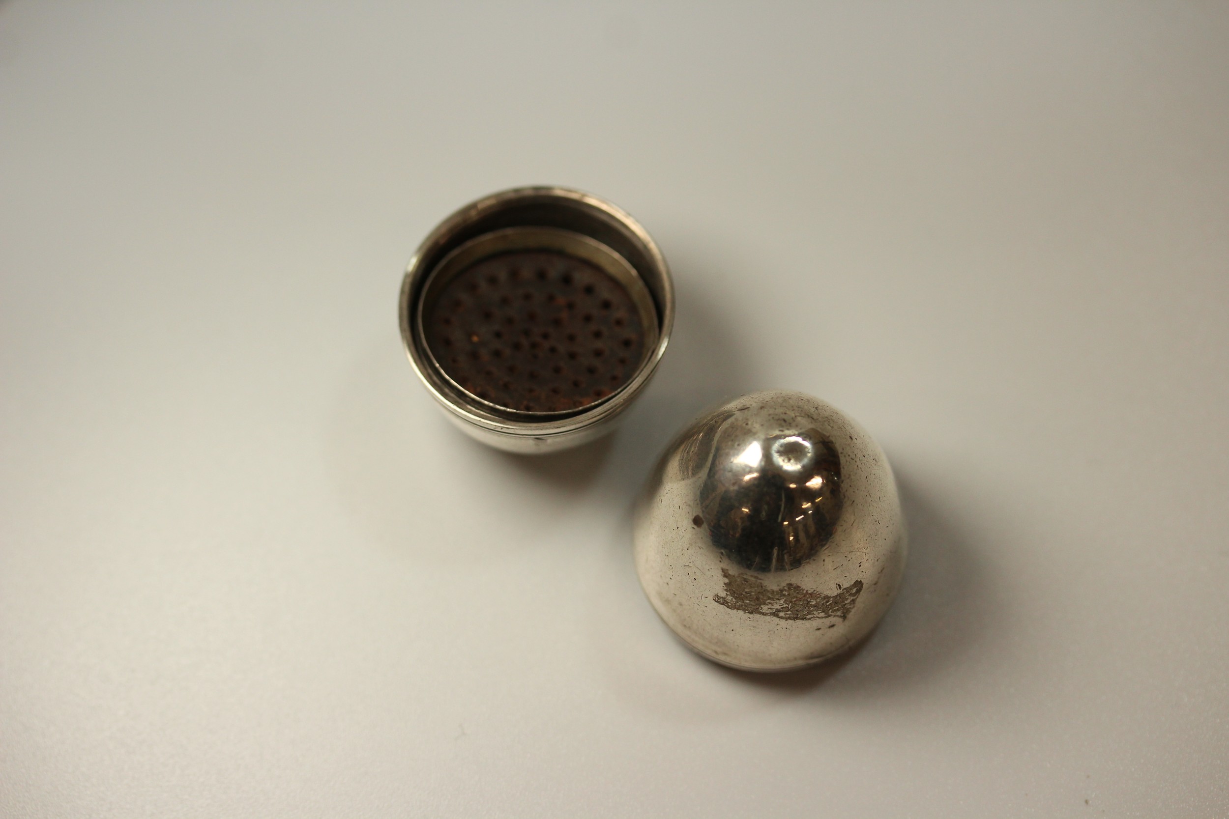 A George III Silver Coloured metal Egg Shaped Nutmeg Grater. Apparently unmarked. With crew on