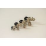 A Set of four Silver Coloured metal Elephants. Apparently unmarked. Each realistically cast and
