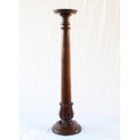 A Victorian Mahogany Jardinière Stand. Circa 1840. In the form of a column. 137cm high. Some old