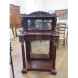 A Regency Mahogany Mirrored Chiffonier. Circa 1815. With a leaf carved frieze above lions paw scroll