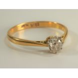 A 22 carat gold and platinum old cut diamond solitaire ring (cracked/damaged stone)