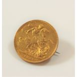 A gold Sovereign mounted as a brooch