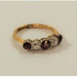 A five stone ruby and diamond ring