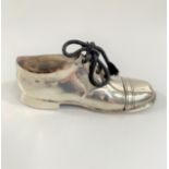 A Sterling Silver Pin Cushion. Chester 1910. In the form of a shoe. With wooden sole. 12.5cm long