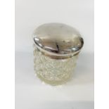 A silver topped toilet jar