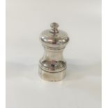 A silver pepper grinder