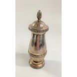 A Heavy Sterling Silver Pepper Grinder. Import marks. With metal fittings. Loaded . 16cm high