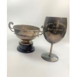 A silver two handled rose bowl on stand and a silver plated trophy cup