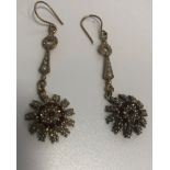 A pair of drop earrings, set with rubies & seed pearls
