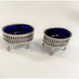 A Pair of Sterling Silver George III Salt cellars. London 1777. With blue glass liners. 8cm wide