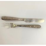 A Chinese Silver Coloured metal Mounted Knife and Fork