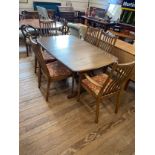 A Modern teak Ercol Style Dining Room Suite. Comprising a dining table and six chairs