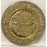 A brass circular wall platter depicting fruits including pineapple, pears, cherries and nuts 44cm