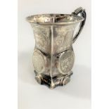 A Victorian Sterling Silver Mug. Birmingham 1853. Chased with scrolling foliage. With a presentation