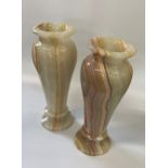 A Pair of Algerian Onyx Vases. 20th Century. Of slender baluster form. 33cm high