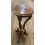 A Victorian mahogany Jardinière Stand. With long curved supports and a circular top. 92cm high