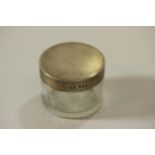 A Cut Glass and Sterling Silver Topped Powder jar. makers mark P W G. London 1938. With engine