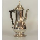 A George III Sterling Silver Coffee Pot. William Cripps. London 1763. Of slender balustre form. With