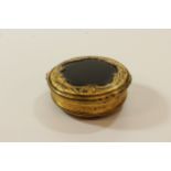A Mid Eighteenth Century Tortoiseshell and Gilt metal Circular Box. Possibly. Embossed with