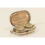 A Sterling Silver Sovereign Case. Birmingham 1890. Of rounded oblong form. Quite plain. 5cm wide.