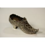 An Edwardian Cast Silver Shoe. German, with import marks for Chester 1908. Decorated throughout with