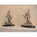 A Pair of Coin Silver Statues.