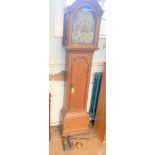 A George III Oak cased Longcase Clock. Circa 1800. The silver dial tarnished. With a key pendulum