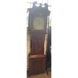 A 19th century mahogany Long case Clock. No maker. The white enamel dial with Roman numerals.