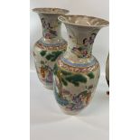 A Pair of Chinese Famille Verte Vases. 20th century. Republic Period. Decorated with figures in a