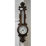 An oak banjo barometer 80cm long.