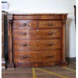A Victorian mahogany Bow front chest of drawers, Circa 1850. Comprising two short and three long