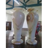 A Pair of Algerian Onyx Vases. 20th Century. Of slender baluster form. 33cm high