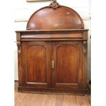 An Early Victorian Mahogany Chiffonier. Circa 1840. With a shaped back above two frieze drawers
