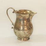 A Sterling Silver Cream jug Stokes & Ireland Ltd . Chester 1938. Quite plain. 11cm high. 154grams.