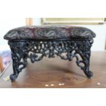 A cast Iron and Upholstered Foot Stool. Possibly Antique