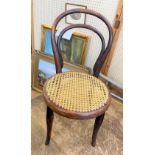 A Child's Bentwood Chair. With rattan seat.