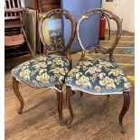 A Pair of Victorian Mahogany and Walnut Balloon Back Chairs.