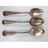 Two Georgian silver serving spoons together with an EP spoon.