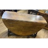 An Antique Oak Gateleg Table. 73cm x 126cm 45cm. Fully open 154cm.