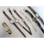 A small collection of mens and womens wrist watches